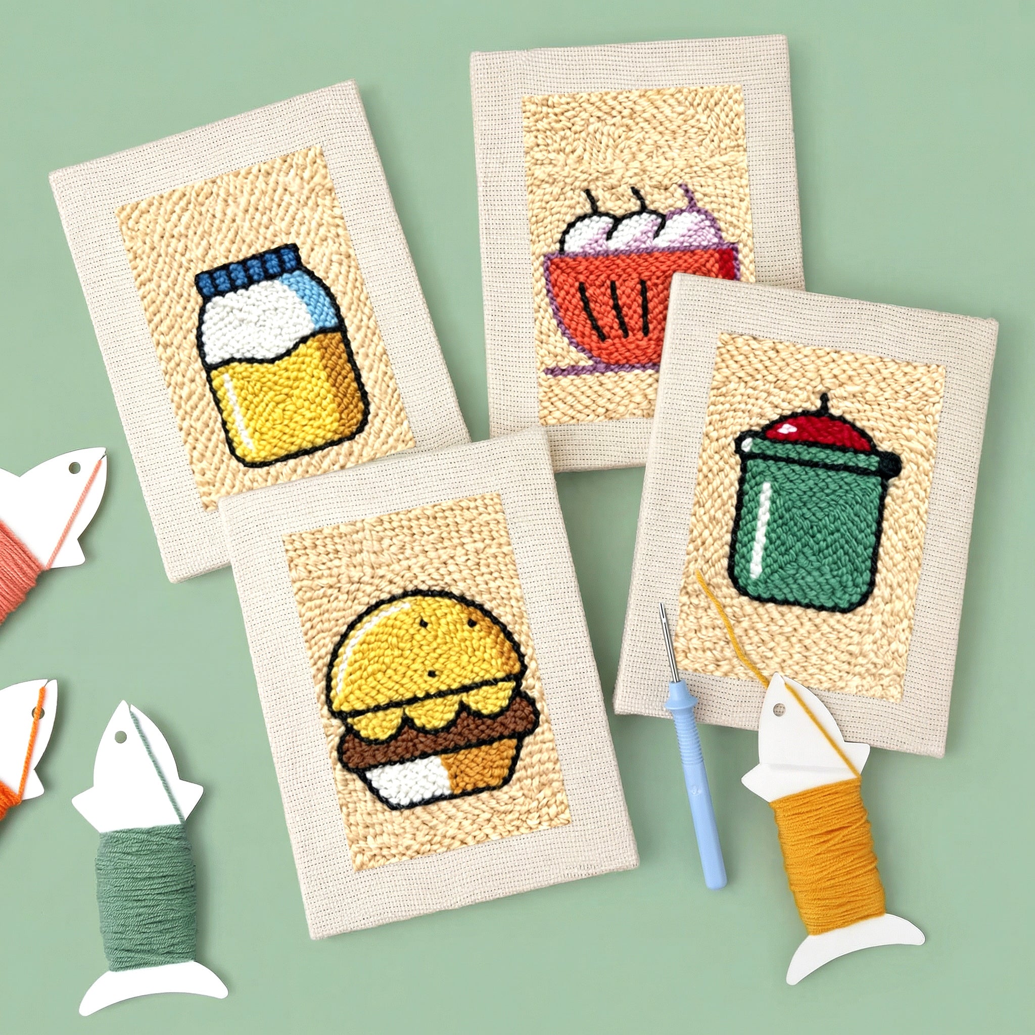 HeyHobby Kitchen Whimsy 4-piece punch needle set for DIY embroidery, featuring colorful punch needle tools and yarns in a neat display.