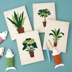Serene Foliage 4-piece punch needle DIY kit by HeyHobby, featuring colorful yarns and tools for creating foliage-inspired embroidery art.