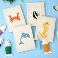 HeyHobby Ocean Friends 4-Piece Punch Needle Set DIY kit with colorful ocean-themed embroidery tools and materials.