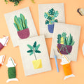 HeyHobby Tranquil Greens punch needle DIY kit with colorful embroidery floss, punch needle, and fabric for crafting projects.