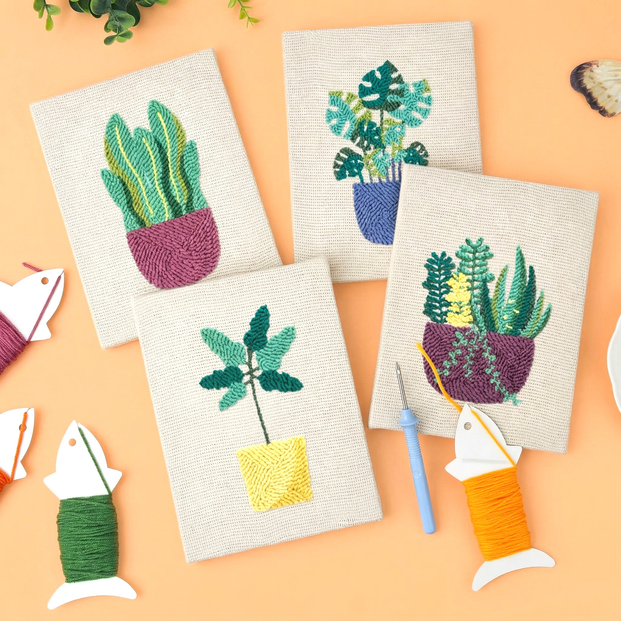 HeyHobby Tranquil Greens punch needle DIY kit with colorful embroidery floss, punch needle, and fabric for crafting projects.