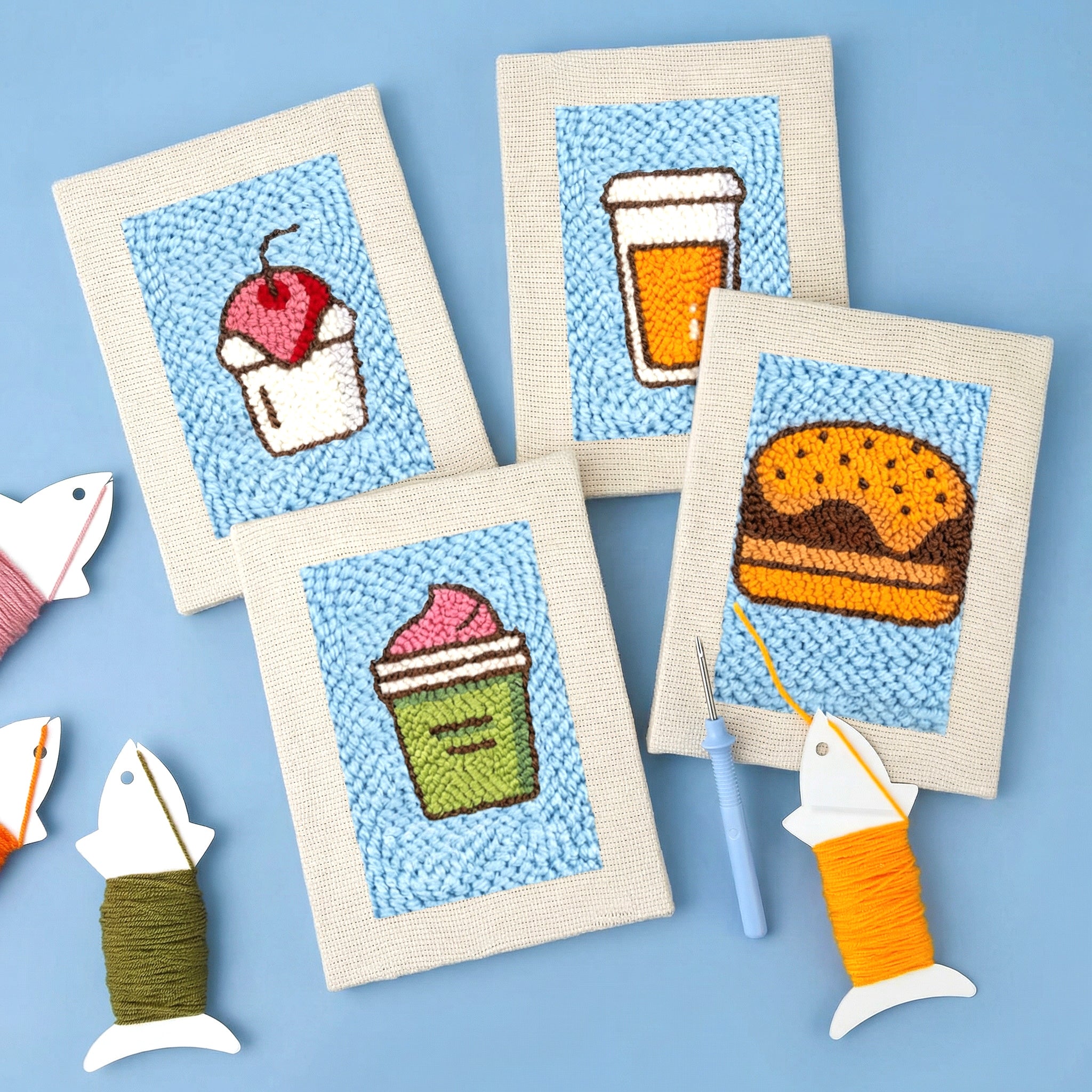 HeyHobby Foodie Fiesta 4-Piece Punch Needle DIY Kit with colorful fabric and tools for creating punch needle art projects.