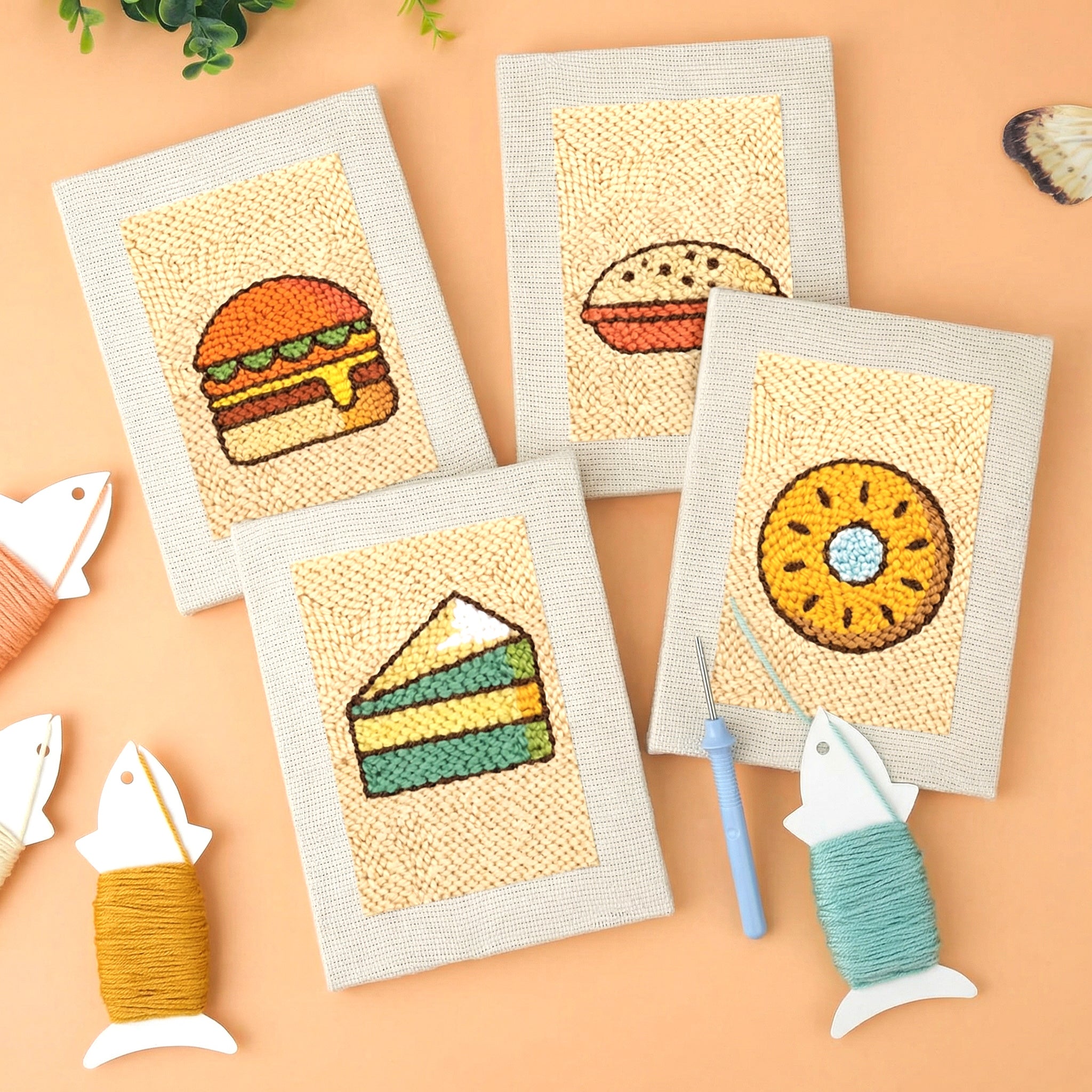 HeyHobby Food Fun 4-Piece Punch Needle Set DIY kit with colorful fabric and tools for fun punch needle embroidery projects.