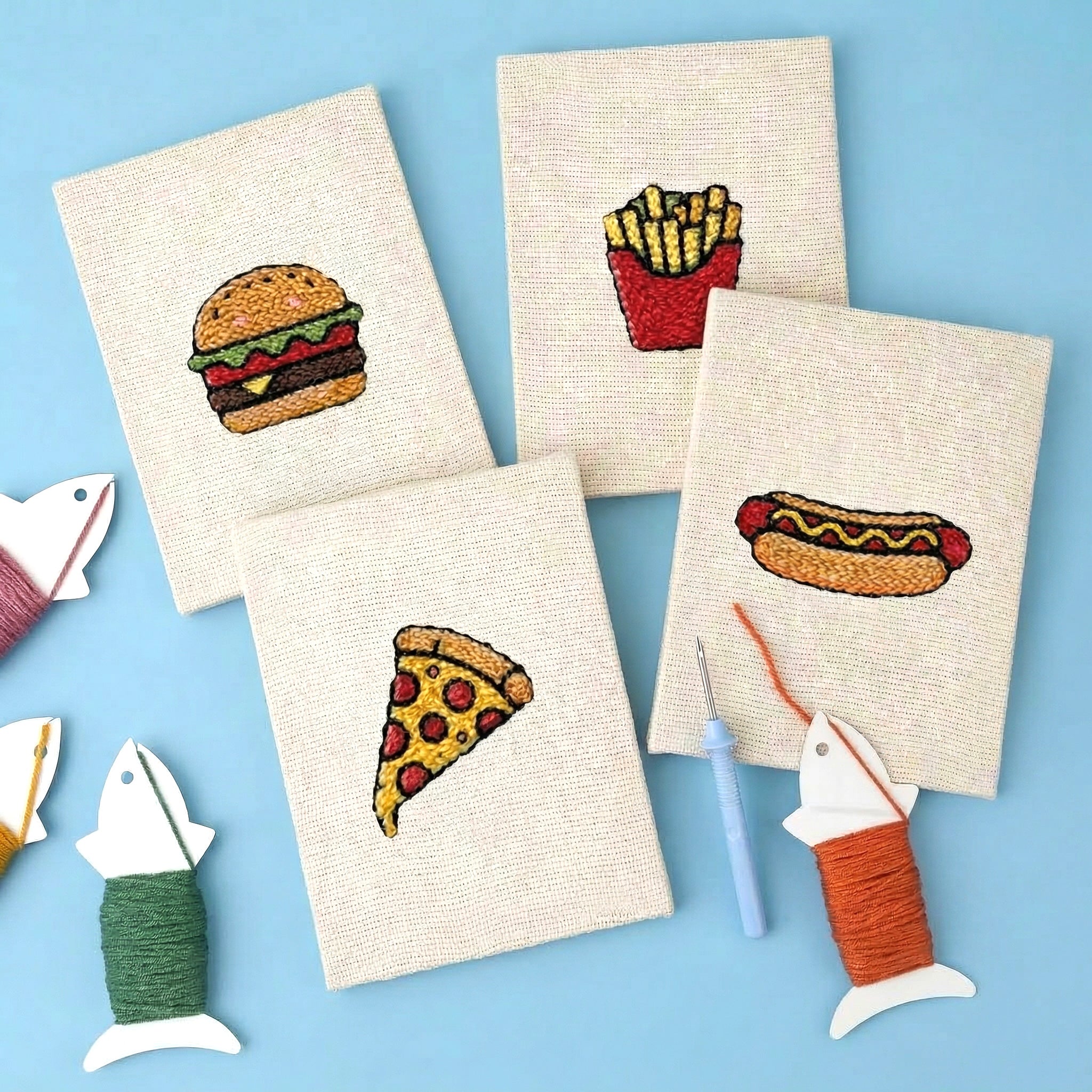 Foodie Fun 4-Piece Punch Needle DIY Kit by HeyHobby with colorful punch needle tools and fabric pieces for crafting.