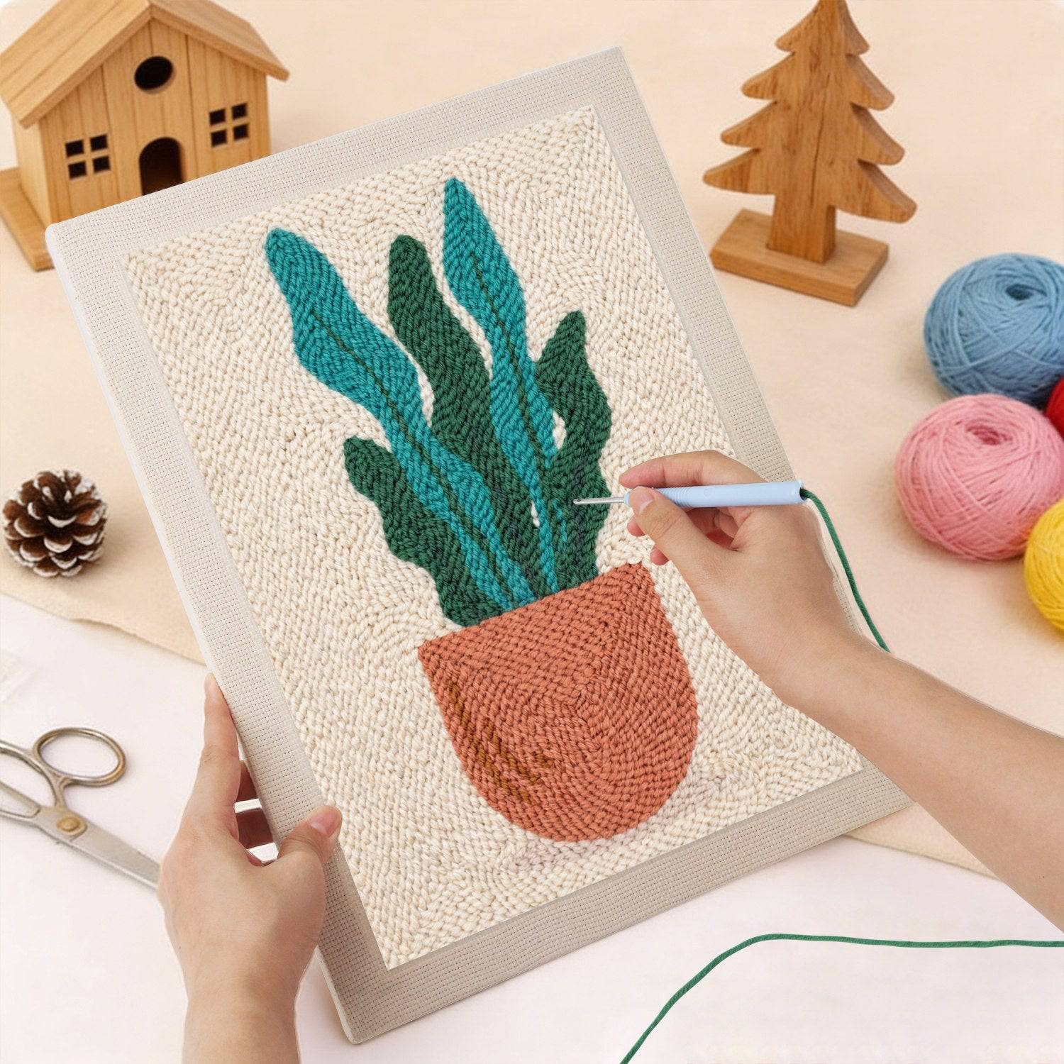 HeyHobby Tranquil Leaf Punch Needle DIY Kit with colorful yarns and tools for creating detailed leaf embroidery artwork.