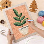 Calm Leaves Punch Needle Kit by HeyHobby featuring colorful yarn and punch needle tools on a wooden surface.