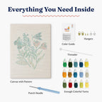 Inside view of the HeyHobby Garden Joy Punch Needle Kit, showing colorful fabric, punch needle, and tools for DIY embroidery project.