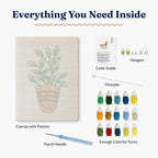 Inside view of HeyHobby Serene Leaf Punch Needle Kit with colorful yarns and tools for DIY embroidery project.