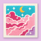 Whimsical punch needle art with pink fluffy clouds, golden crescent moon, and white stars on turquoise sky