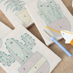 HeyHobby Botanical Bliss 4-Piece Punch Needle Set DIY kit with colorful embroidery tools and fabric for crafting.