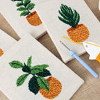 Earthy Greens 4-piece punch needle DIY kit by HeyHobby, featuring colorful punch needle tools and vibrant craft materials.