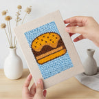 Foodie Fiesta 4-piece punch needle DIY kit by HeyHobby featuring colorful tools and materials for crafting punch needle art.