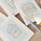 HeyHobby Foodie Fiesta 4-Piece Punch Needle Set DIY kit with colorful tools and fabric for creative punch needle embroidery.