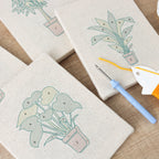 HeyHobby Serene Foliage 4-Piece Punch Needle DIY Kit with colorful embroidery tools and fabric for creative craft projects.