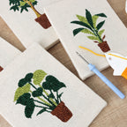 HeyHobby Serene Foliage 4-Piece Punch Needle DIY Kit with colorful foliage designs and punch needle tools for crafting.