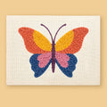 HeyHobby Butterfly Whimsy Punch Needle Kit DIY kit with colorful punch needle embroidery supplies for crafting butterfly designs.