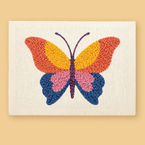 HeyHobby Butterfly Whimsy Punch Needle Kit DIY kit with colorful punch needle embroidery supplies for crafting butterfly designs.
