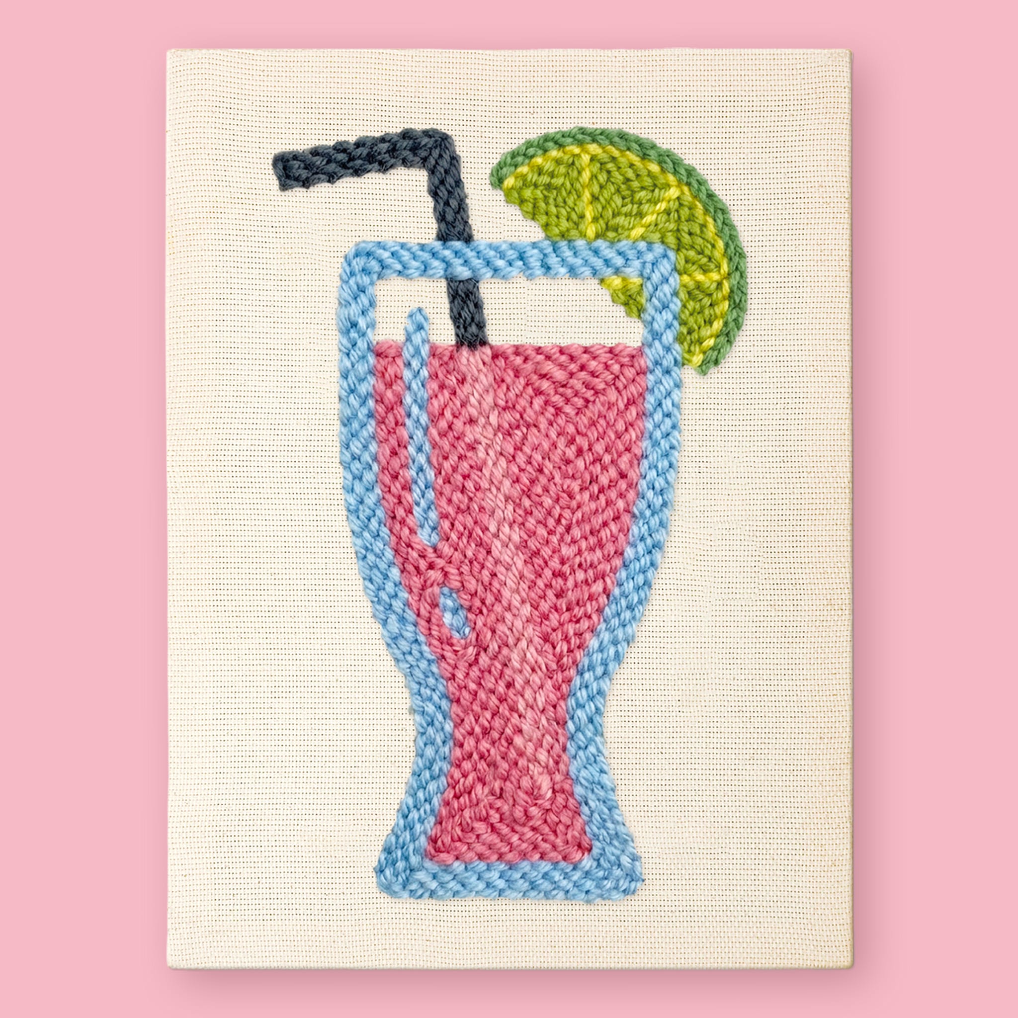 Tropical Sip Punch Needle Kit by HeyHobby featuring colorful fabric, punch needle tools, and tropical-themed embroidery design.